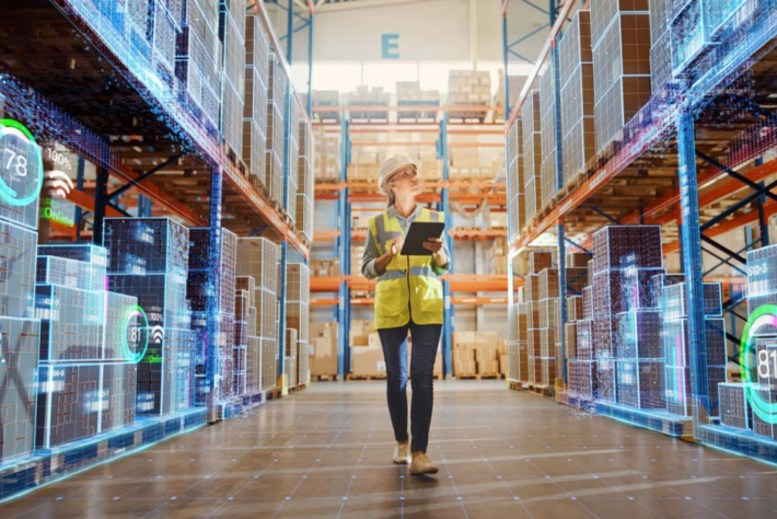 A woman walking trough a factory