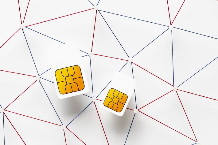 Top view of two sim cards with internet communication network